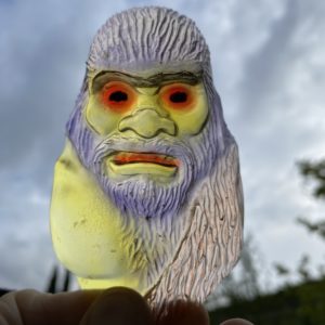 Caveman Paperweight Flat Head Painted On Clear Resin